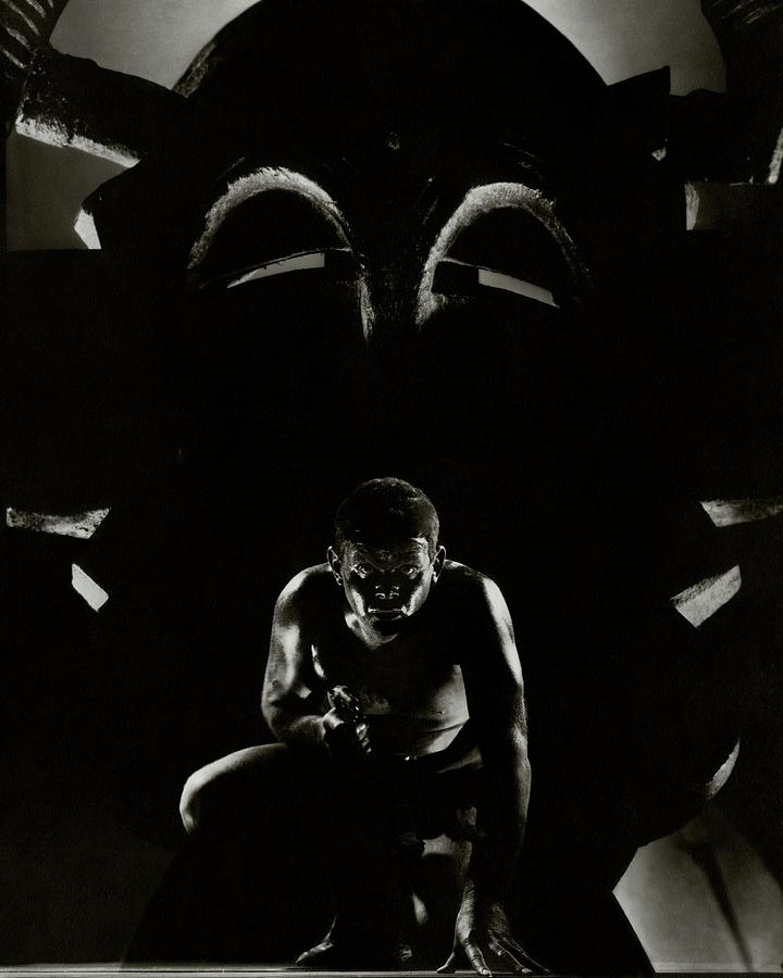 Lawrence Tibbett Crouching And Holding A Gun Photograph by Edward Steichen