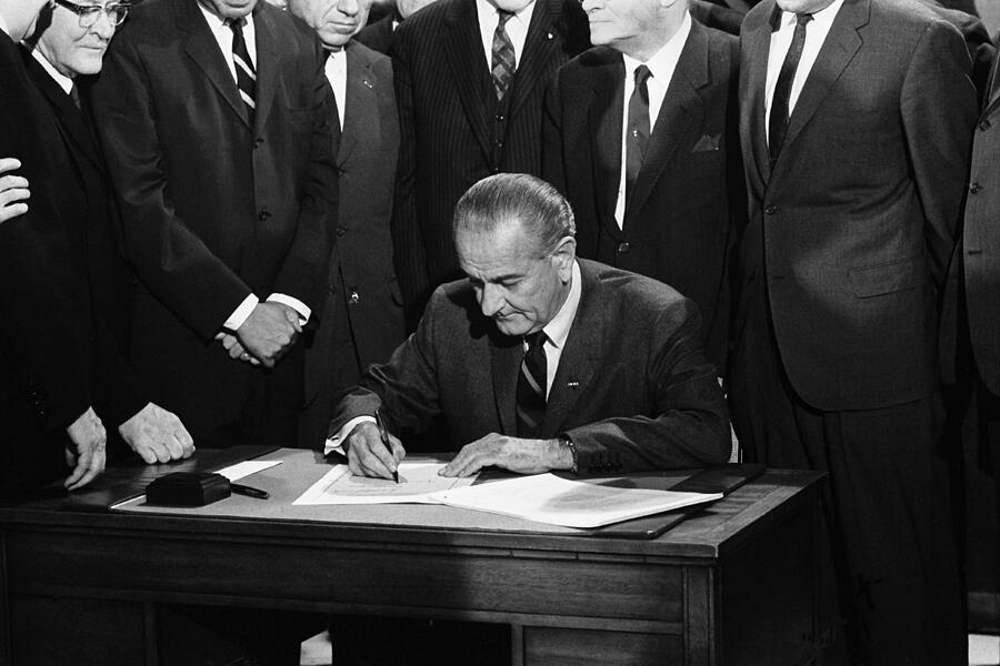 Lyndon Johnson Photograph - LBJ Signs Civil Rights Bill by Underwood Archives Warren Leffler