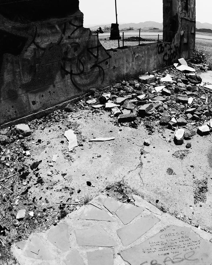 Left Behind in the Rubble -- Motorcyclist and Graffiti in Amboy, California Photograph by Darin Volpe