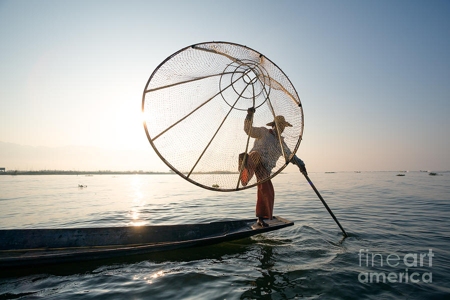 Leg rowing fisherman - Inle lake - Myanmar Photograph by Matteo Colombo