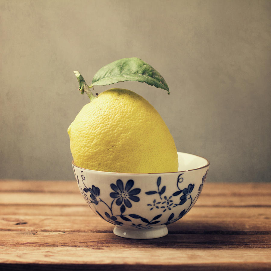 Lemon In Bowl With Flowers Photograph by Copyright Anna Nemoy(xaomena)
