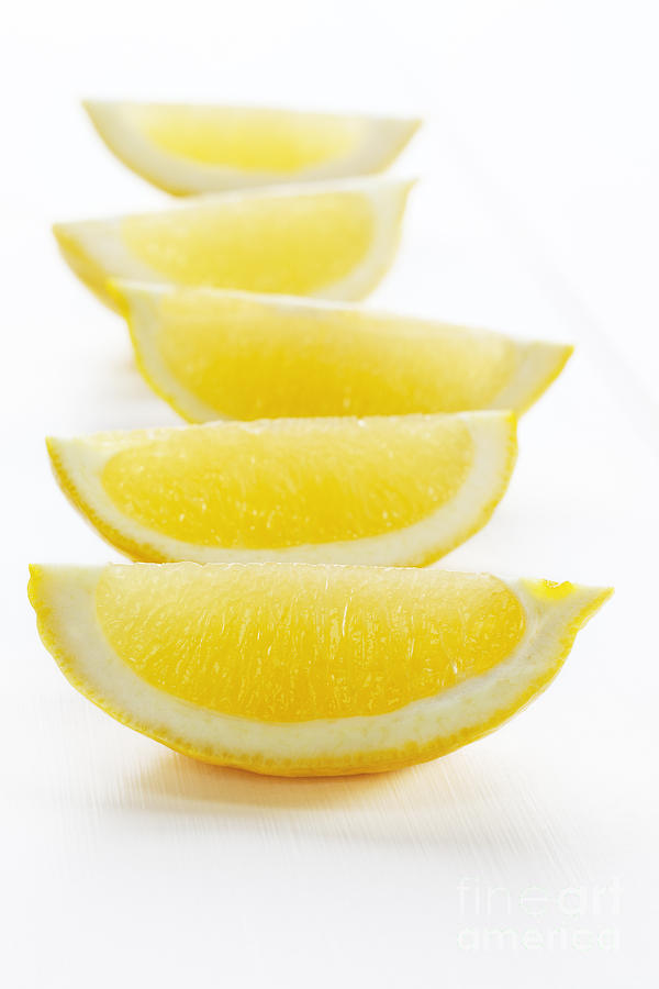 Lemon Photograph - Lemon Wedges on White Background by Colin and Linda McKie