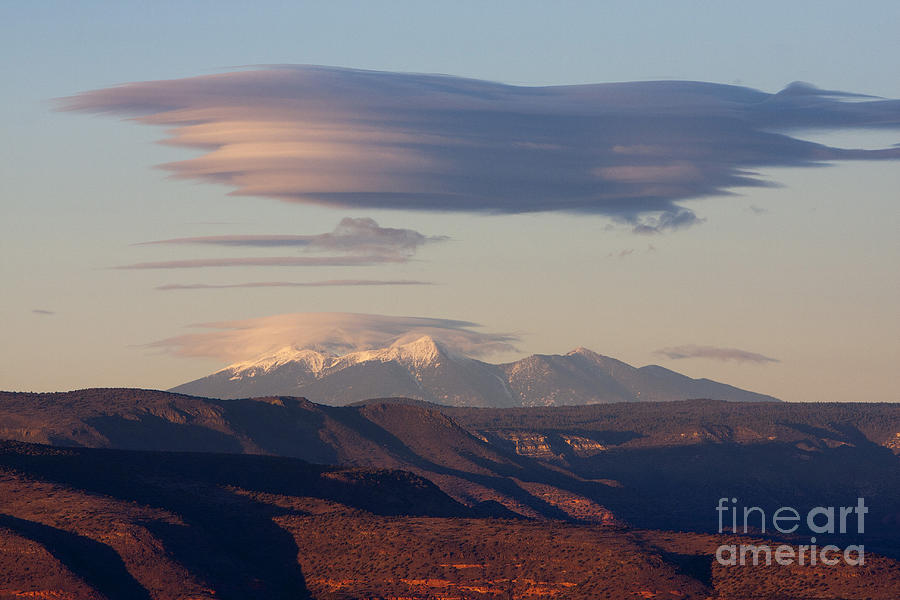 Lenticular Cloud hovers over the San Francisco Peaks of Flagstaff Arizona Photograph by Ron Chilston
