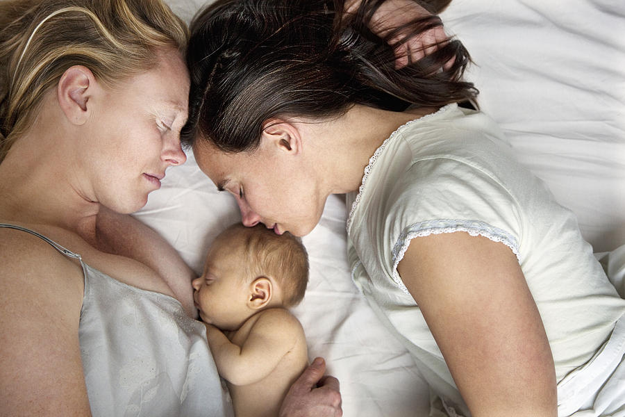 Lesbian couple with baby boy Photograph by David Trood