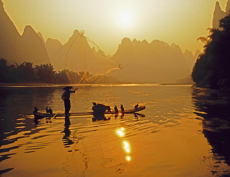 Li River net toss Photograph by Dennis Cox