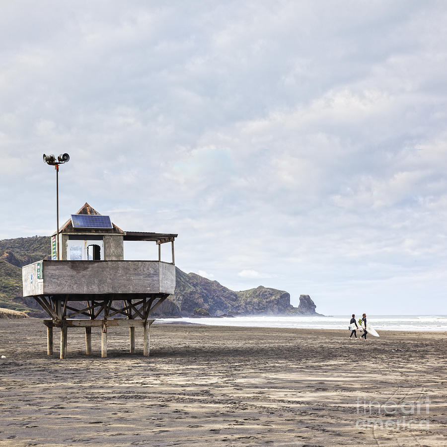 Lifeguard Tower and Surfers Bethells Beach New Zealand Photograph by Colin and Linda McKie