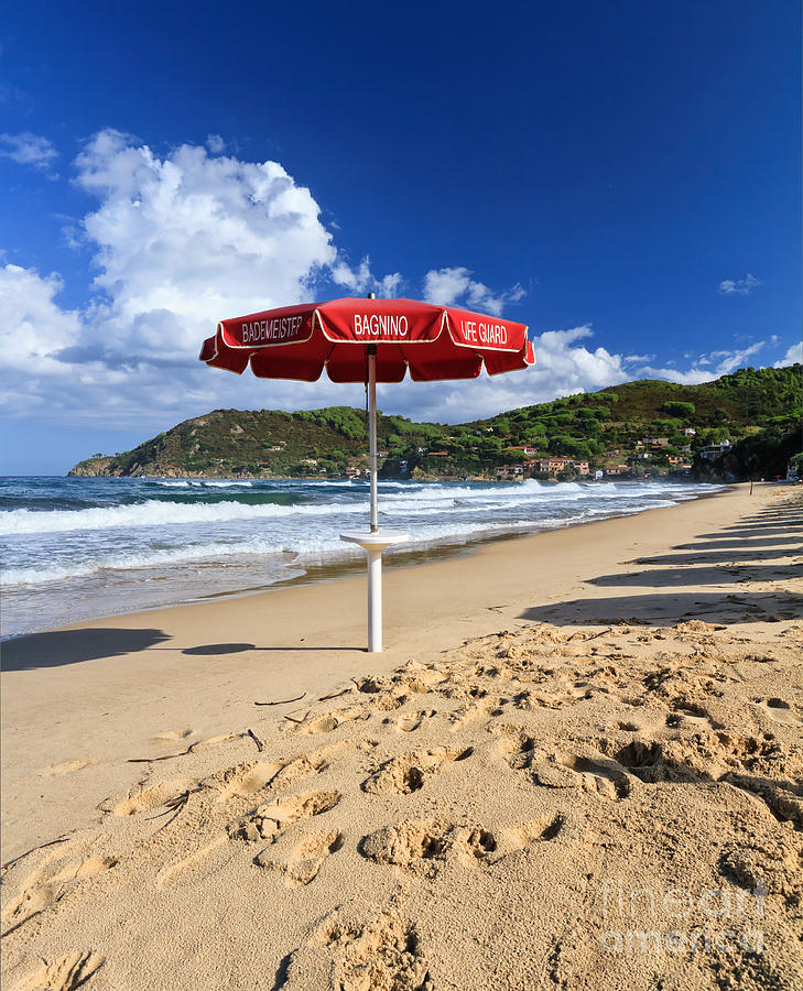 Lifeguards umbrella in Biodola beach Photograph by Antonio Scarpi