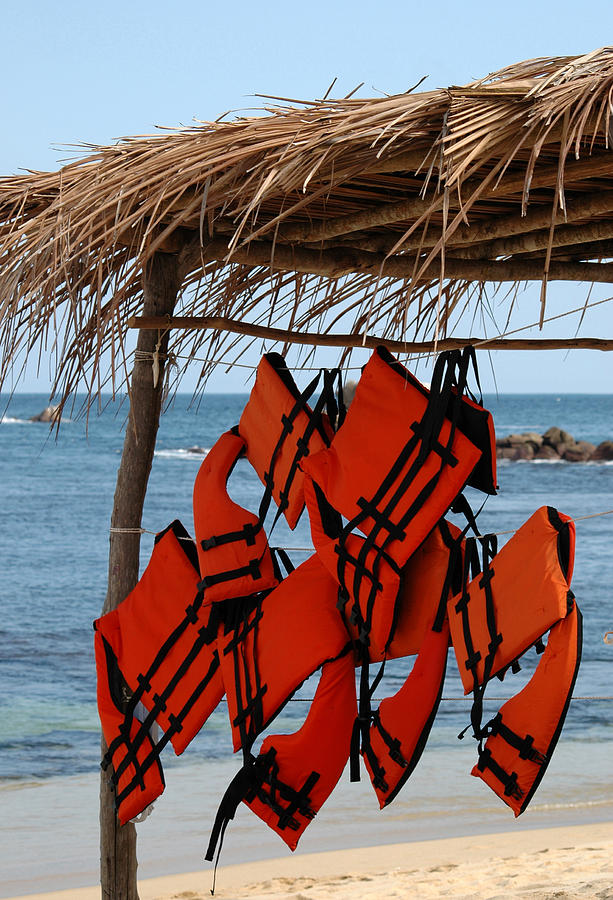 Lifejackets hanging at the ready on a beach in the Huatulco area Photograph by Rob Huntley