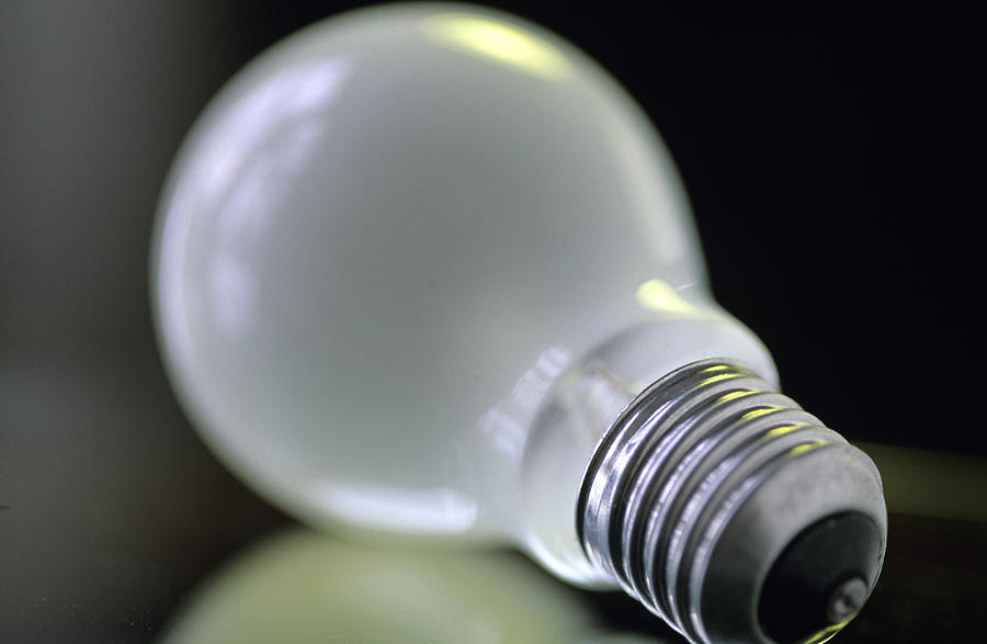Light bulb, close up Photograph by Achim Sass