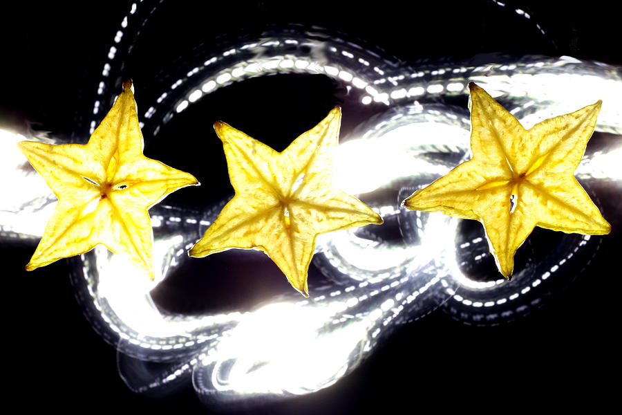 Light painting on star fruit slice Photograph by Paul Ge
