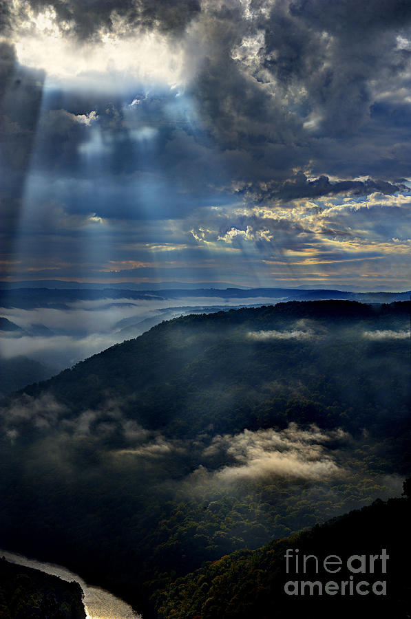Light shinng on cloud in valley Photograph by Dan Friend