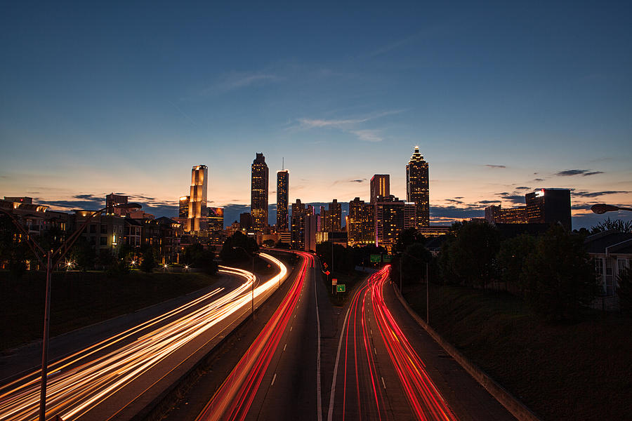 Light streaks through the Atlanta highways at blue hour Photograph by Marilyn Nieves