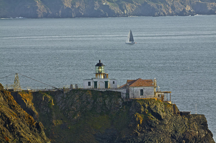 Lighthouse and Sailboat Photograph by SC Heffner