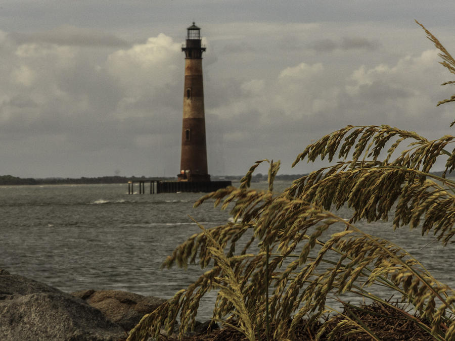Lighthouse and Sea Oats Photograph by Kevin Senter