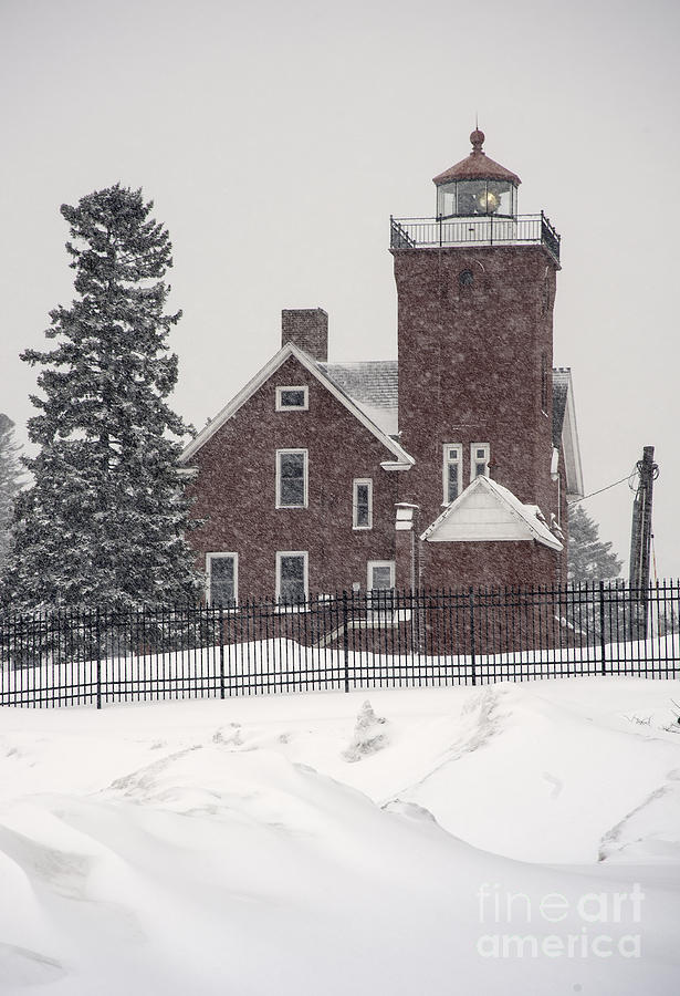 Lighthouse and Snow Photograph by Fred Lassmann