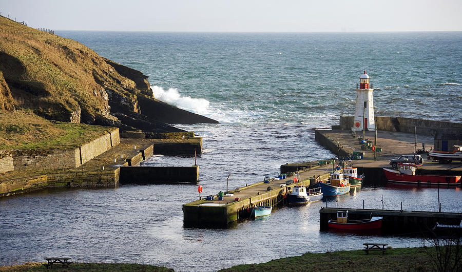 Lighthouse At A Harbour Photograph by Steve Allen/science Photo Library