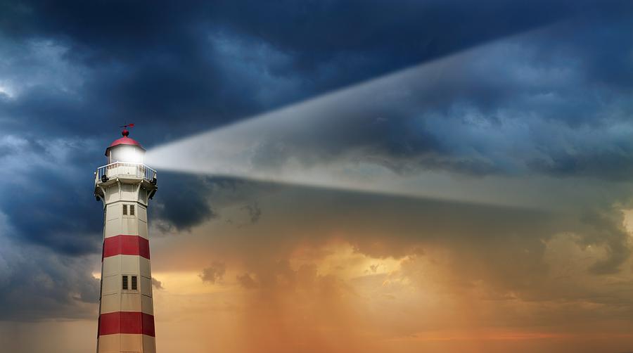 Lighthouse at dawn, bad weather in background Photograph by Olaser