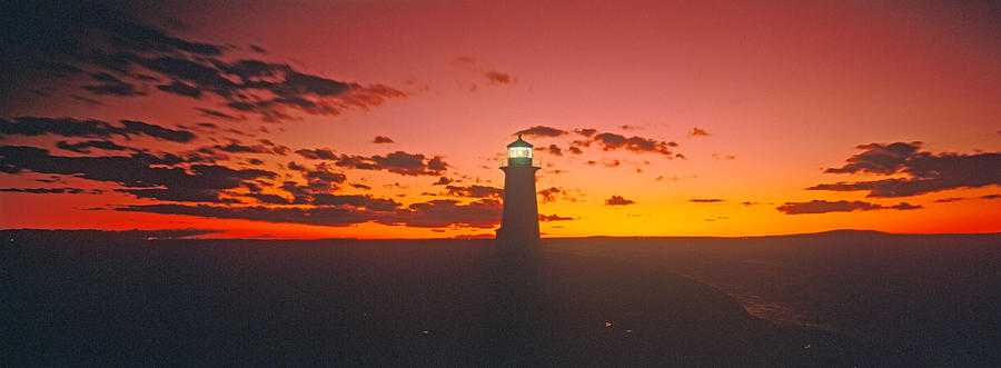 Sunset Photograph - Lighthouse At Sunset, Peggys Cove, Nova by Panoramic Images