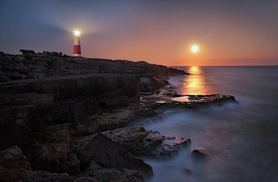 Lighthouse In Moonlight Photograph by Getty Images