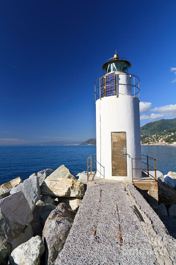 Lighthouse Over The Sea Photograph by Antonio Scarpi