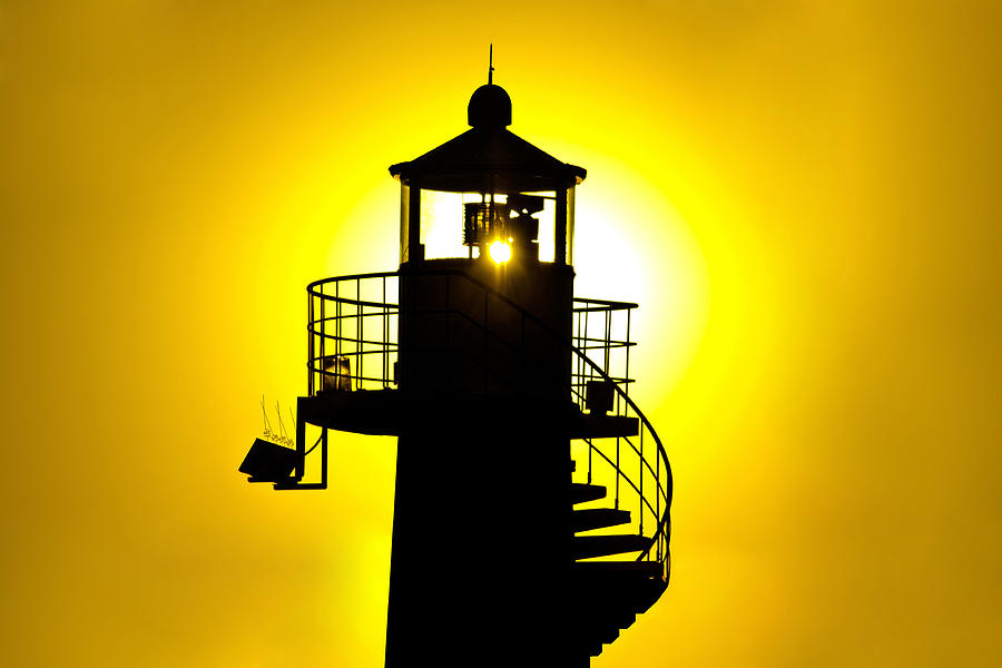 Lighthouse silhouette at yellow sunset Photograph by Brch Photography