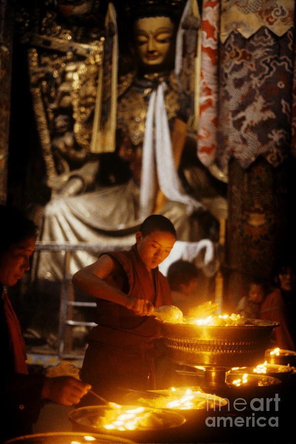 Lighting Butter Lamps - Jokhang Temple Lhasa Photograph by Craig Lovell