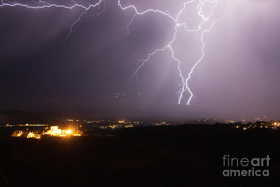 Lightning and the Douglas Mansion in Jerome Arizona Photograph by Ron Chilston