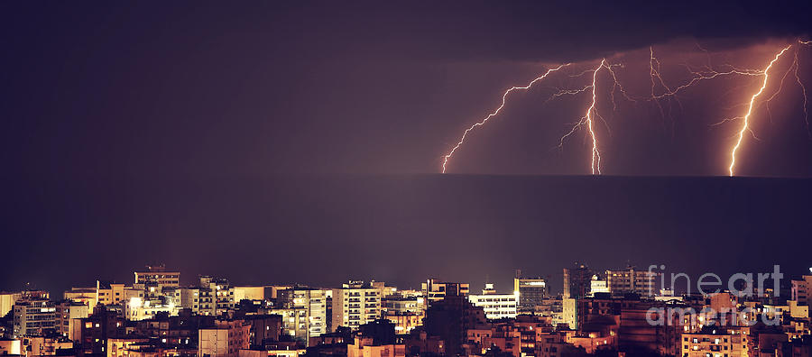 Lightning over night city Photograph by Anna Om