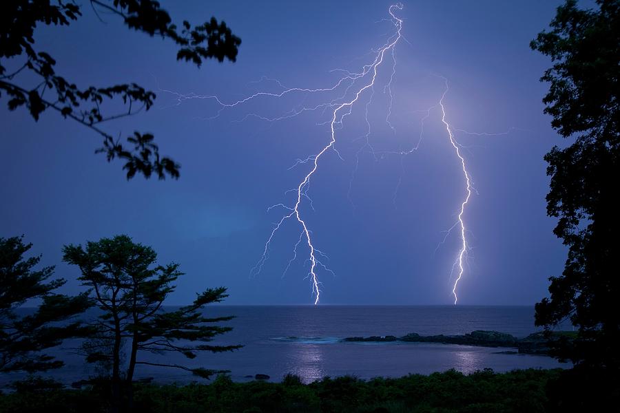 Lightning Over Sea Photograph by Peter Menzel