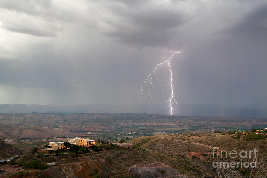 Lightning storm over the Verde Valley as seen from Jerome Arizona Photograph by Ron Chilston