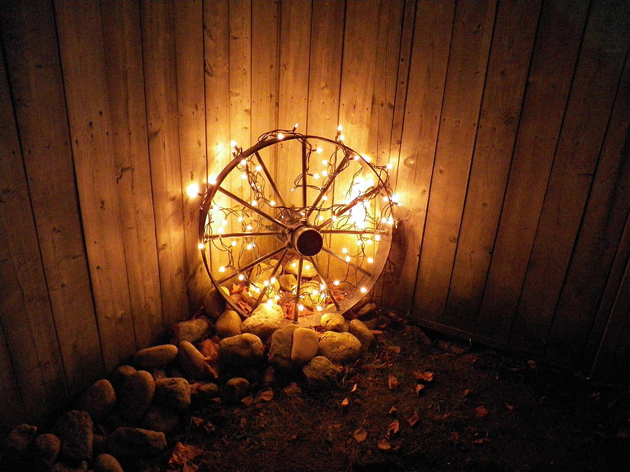 Lights on Wagon Wheel Photograph by Corinne Elizabeth Cowherd