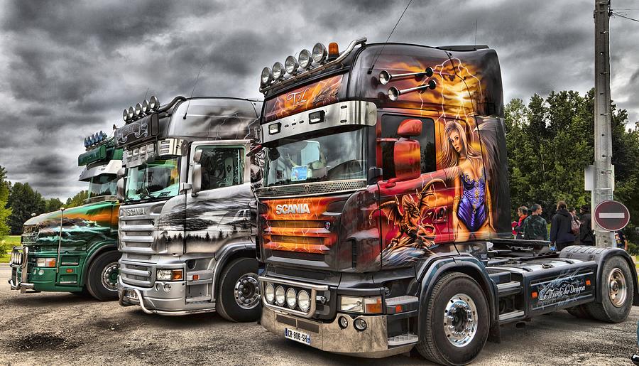 Nicely painted european Scania cabover trucks at a display in line up Photograph by Mick Flynn