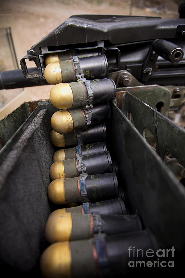 Operation Enduring Freedom Photograph - Linked 40mm Rounds Feed Into A Mark 19 by Stocktrek Images