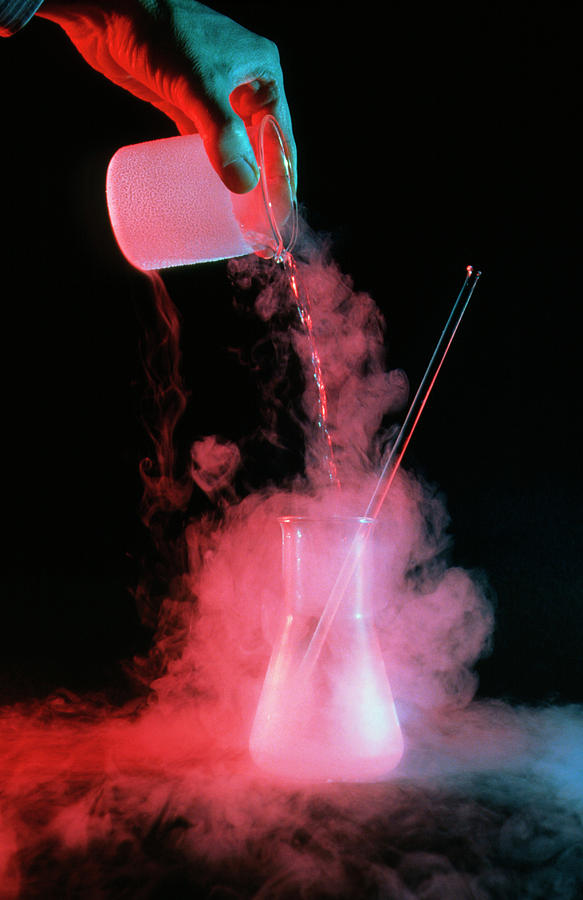 Liquid Nitrogen Being Poured Into Flask Photograph by David Taylor/science Photo Library