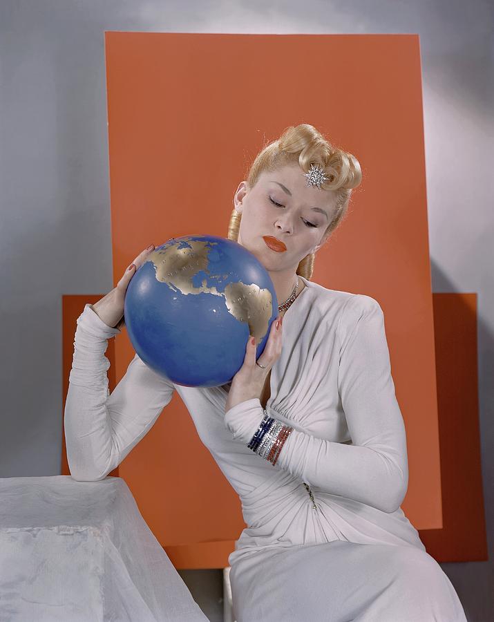 Lisa Fonssagrives Holding A Globe Photograph by Edward Steichen