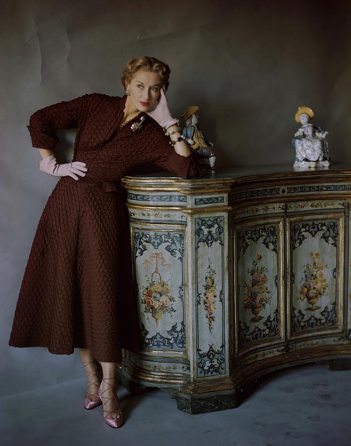 Lisa Fonssagrives Wearing A Brown Dress Photograph by Horst P. Horst