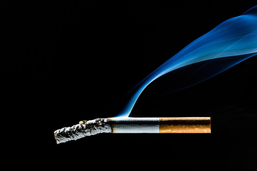 Still Life Photograph - Lit Cigarette by Philippe Garo