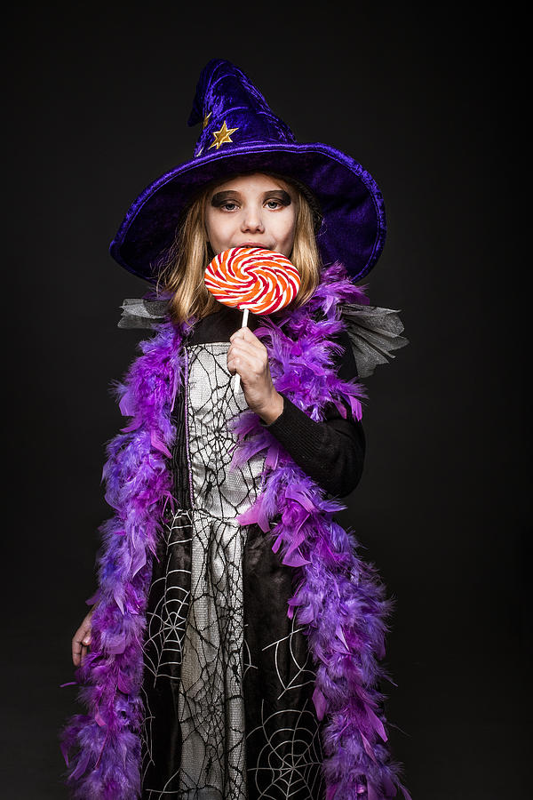 Little Beautiful Girl With Halloween Witch Costume Eat ...