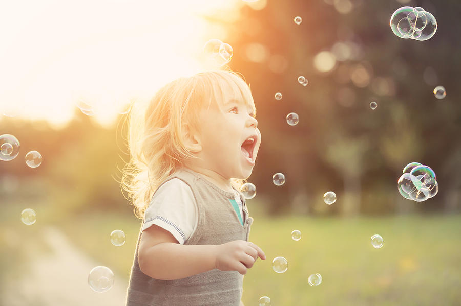 Little boy and soap bubbles Photograph by Portishead1