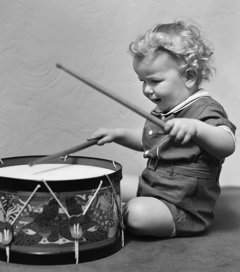 Little Boy Playing Toy Drum, C.1930s Photograph by H. Armstrong Roberts/ClassicStock
