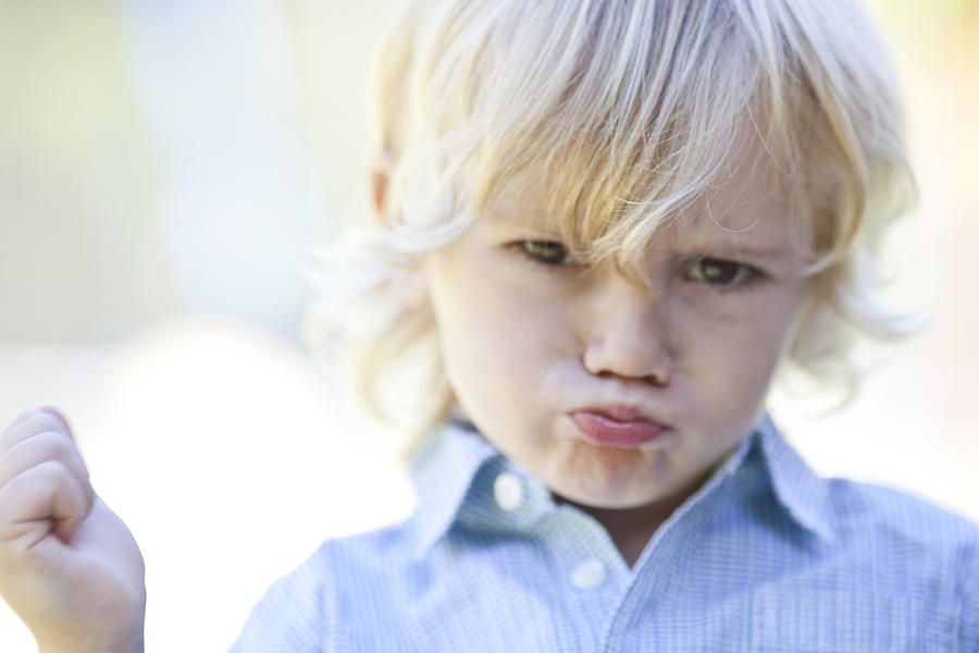 Little boy pouting Photograph by PhotoAlto/Ale Ventura