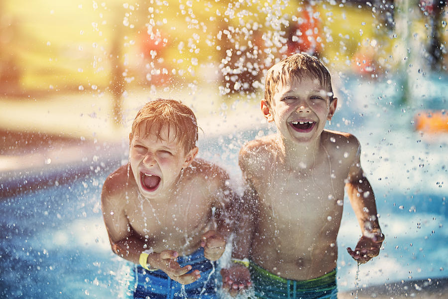 Little boys having fun in waterpark Photograph by Imgorthand