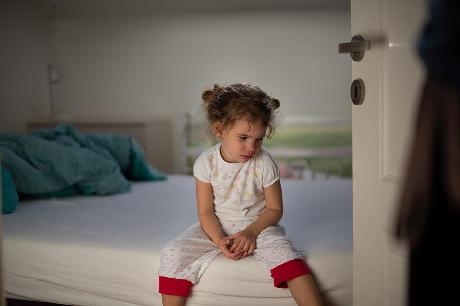 Little girl crying in bedroom Photograph by SanyaSM
