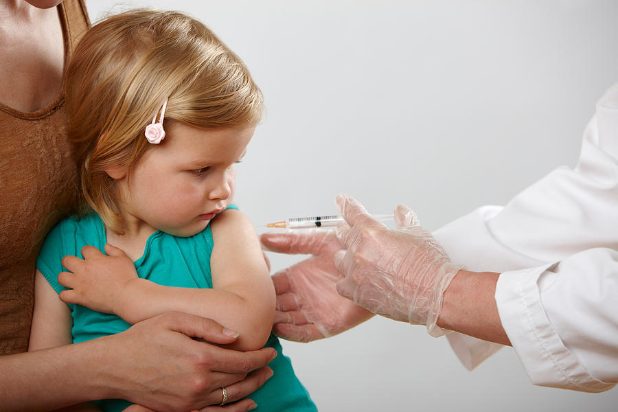 Little girl having an injection Photograph by Image Source