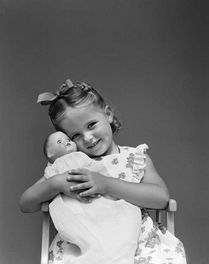 Little Girl Holding Doll, C.1940s Photograph by H. Armstrong Roberts/ClassicStock