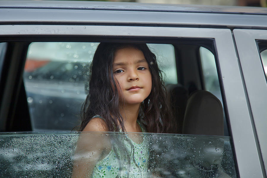 Little girl looking out of car window Photograph by Abhinandita Mathur 