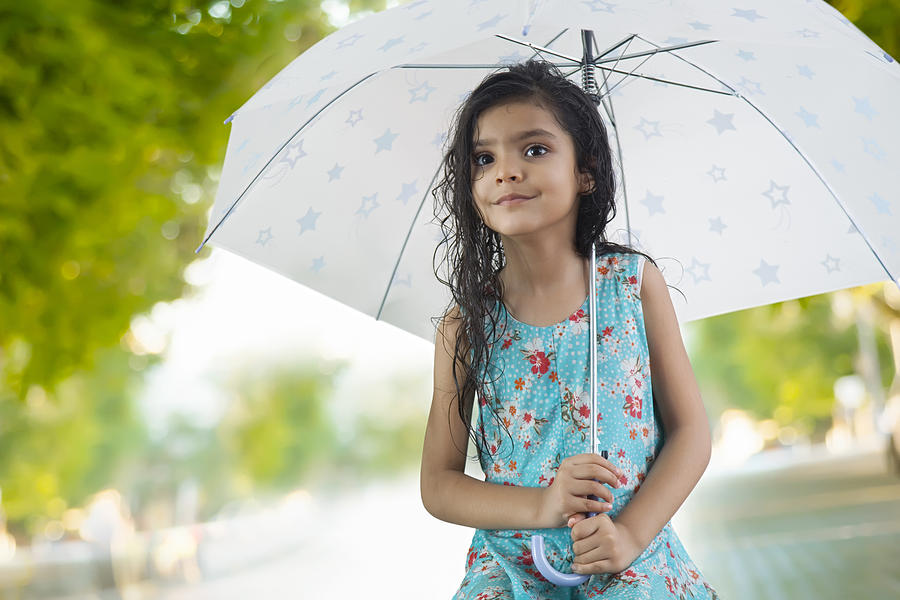 Little girl with umbrella Photograph by Abhinandita Mathur 
