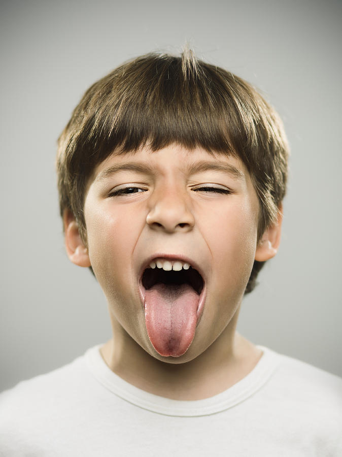 Little kid sticking out his tongue Photograph by SensorSpot