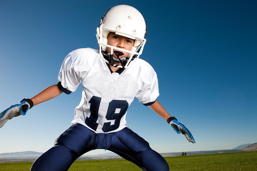 Little League Football Player Ready to Tackle Photograph by Avid_creative