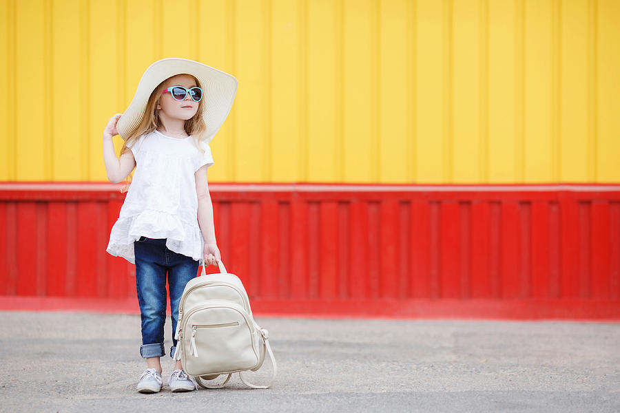 Little schoolgirl with a white backpack Photograph by Alexandr_1958